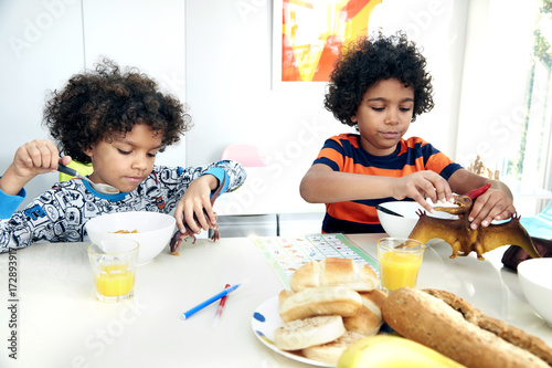 "Boys eating breakfast" Stock photo and royalty-free images on Fotolia