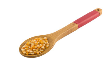 Popcorn corn. Raw grain in a spoon