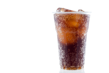 cola with ice in plastic glass on white background