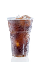 cola with ice in plastic glass on white background