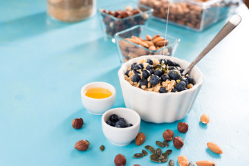 Perfect breakfast. Oatmeal with blueberries. Healthy eating for the whole family. wood background.