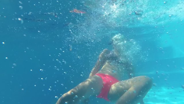 teenage girl falls into the water, floundering underwater need help
