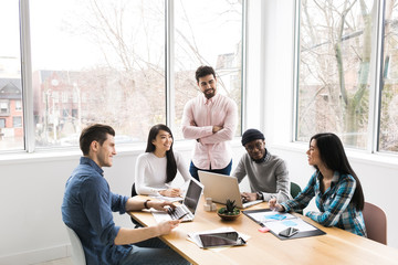 Young professionals working on laptops in an office