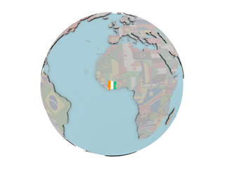 Ivory Coast with flag on globe