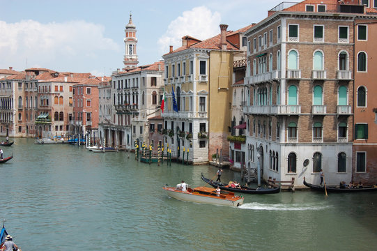 Gondola on the Grand Canal near Palazzo Dario in Venice Italy