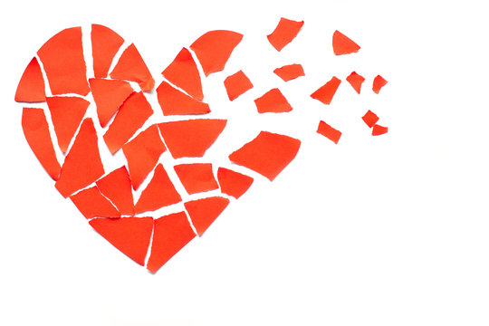 Broken heart breakup concept separation and divorce icon. Red crumpled paper shaped as a torn love