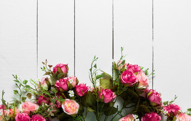 bouquet pink roses on a white wooden table,valentine background,top view.