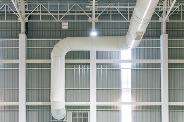 HVAC duct air conditioner ventilation pipes system in white insulation material hanging from the...
