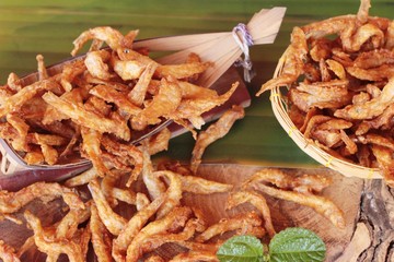 Fried fish is tasty on wood background