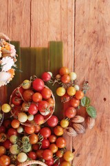 Fresh tomatoes for cooking on wood background