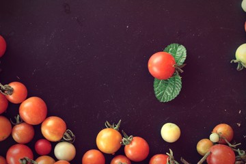 Fototapeta na wymiar Fresh tomatoes for cooking on wood background