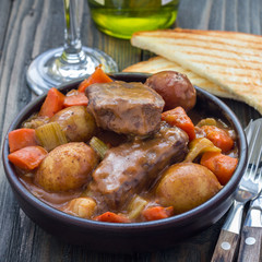 Hearty beef stew with carrot, celery, shallot and potato, square format