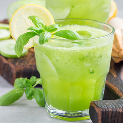 Homemade lemonade with cucumber, basil, lemon, honey and sparkling water, square format