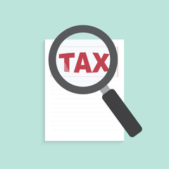 Magnifying glass over the word tax on form