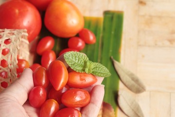 Fresh red tomatoes organic on wood background
