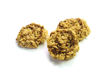 Crispy rice topped with sugar cane juice isolated on white background