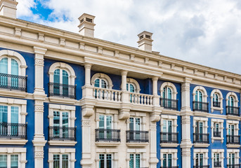 Fototapeta na wymiar Blue colored luxury apartment building