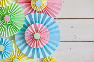 Colorful bright pastel paper rosette. Decorating for a party.