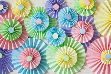 Colorful bright pastel paper rosette. Decorating for a party.