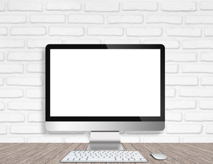 Modern Computer Monitor on a wooden desk with white brick wall background