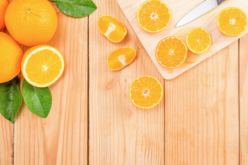 Orange juice in glass and fresh citrus around  on wooden table background fruit product display or montage