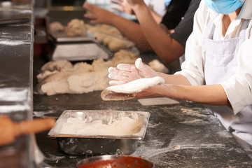 Preparing pizza dough