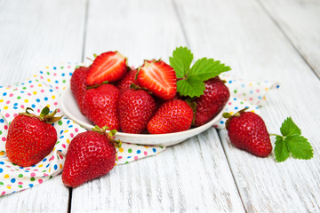 ripe strawberries on wooden table