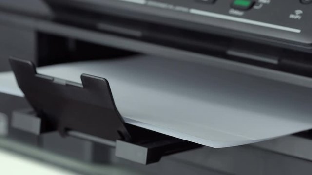 Closeup shot of Printing document paper with inkjet printer
