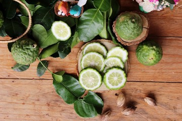 Obraz na płótnie Canvas Fresh organic bergamot herb and lime leaf