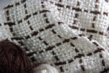 colorful knitted garments and blankets, comb loom