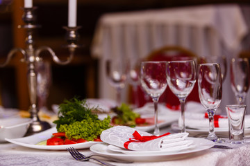 Served table in restaurant with dishes and glasses
