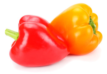 two red and yellow sweet bell peppers isolated on white background