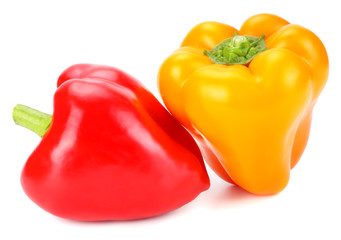 two red and yellow sweet bell peppers isolated on white background
