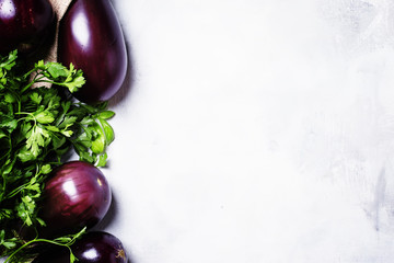Fresh eggplant and parsley, copy space, top view