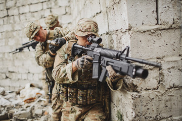 Army soldier during the military operation in the city. war, army, technology and people concept.