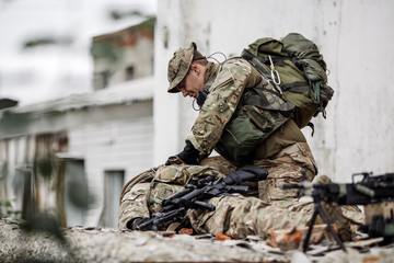 Army soldier during the military operation in the city. war, army, technology and people concept.