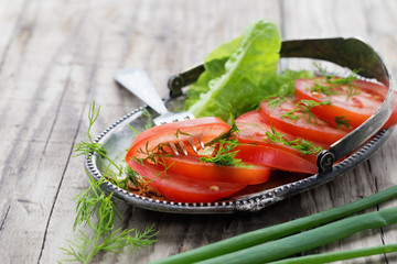 Snack from tomato in rural style