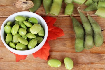 Green japanese soybean delicious on wood background