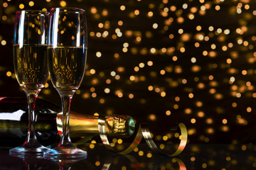 Champagne new year, golden bokeh background