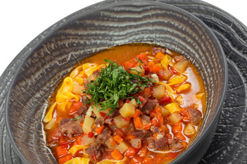 Plate of vegetable soup with meat