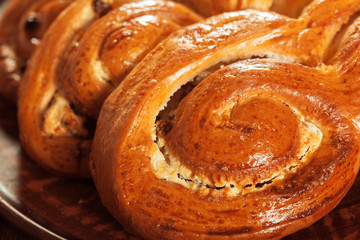 Fototapeta premium Freshly baked bread on wooden table