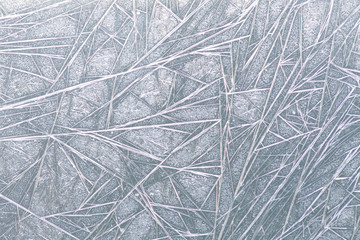 Frozen window ice pattern texture, snowflakes and icy background, close-up, soft focus