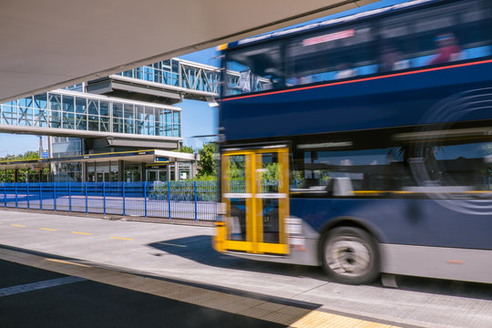 Blurred moving bus at park and ride transport station on North Shore, New Zealand, NZ