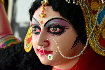 Artisan of West Bengal making clay idol of Godess Durga ahed of Durga festival