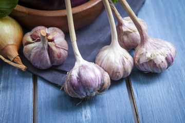 Fresh healthy eggplants on dark wooden background.