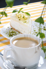 cheese cake behind the coffee
