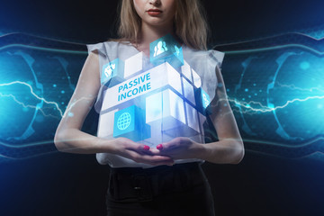 The concept of business, technology, the Internet and the network. A young entrepreneur working on a virtual screen of the future and sees the inscription: Passive income