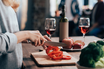 woman cutting pepper