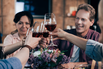 friends drinking wine at dinner