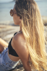 Naklejka premium Pretty Blonde Girl on The Beach 